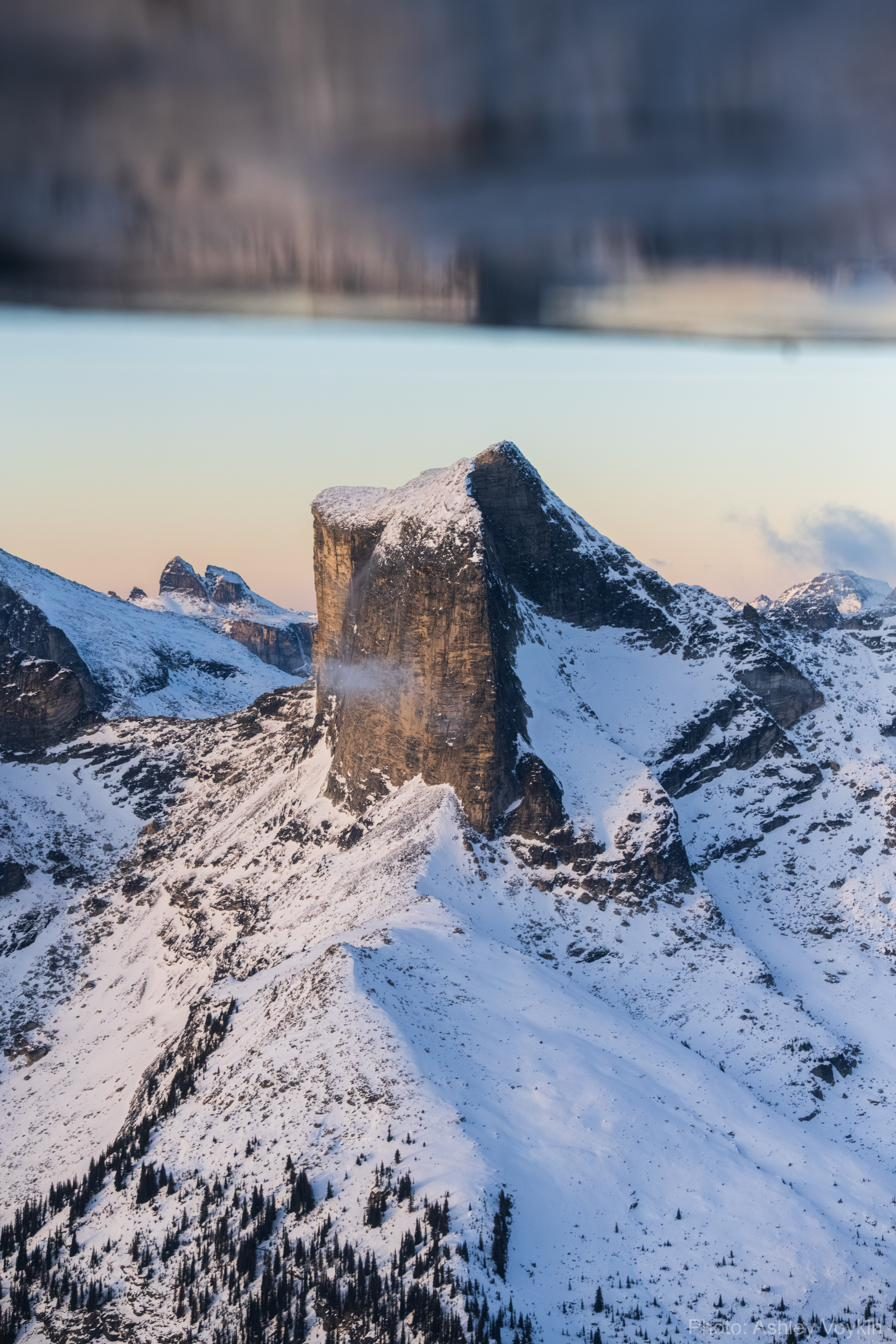 Snow-covered peaks under moonrise. Photo by Ashley Voykin.